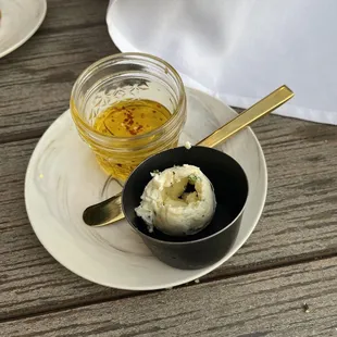 Dipping oil &amp; butter that comes with the bread