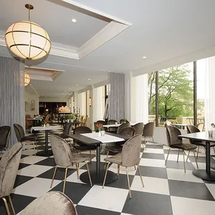 Attractive features of American Slang include a large black and white checkered floor and sweeping view of the iconic Country Club Plaza.