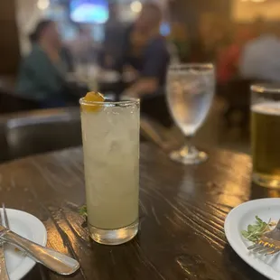 a glass of lemonade on a table