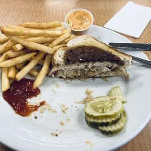 Half of my Turkey Reuben and fries (since I was hungry and ate the first half of the sandwich before snapping the pic). Delicious!!