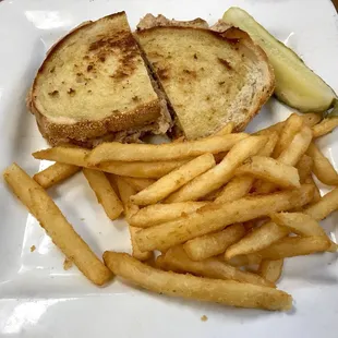 Tuna melt with french fries.