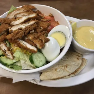 Chicken strip salad with honey mustard dressing.