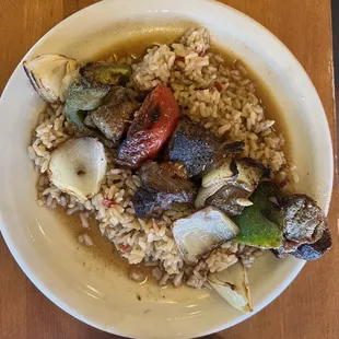 Steak kebab on rice pilaf