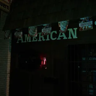 a neon sign in the dark