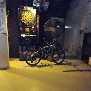 a bicycle parked in front of a game machine