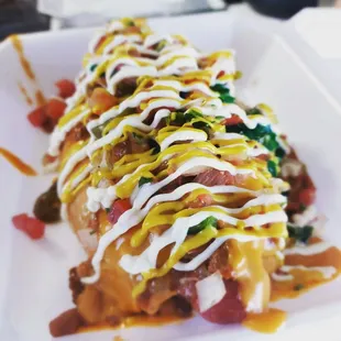 THE MAVERICK is our signature dog loaded with every delicious topping you can think of on top of our amazing custom bread!