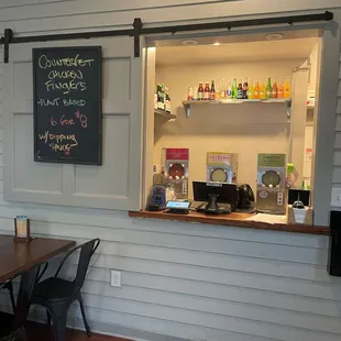 Order at the window and they will bring you your food.