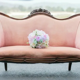 The softest of pink, blushing on our "Sybil" settee, is one-of-a-kind!