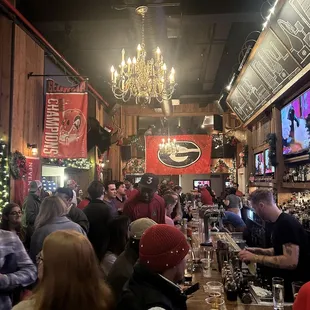 a large group of people at a bar