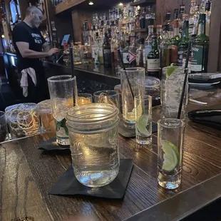 a bar with a bartender in the background