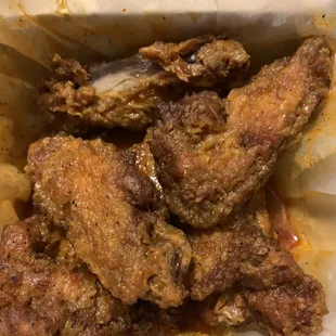 a closeup of a basket of fried chicken