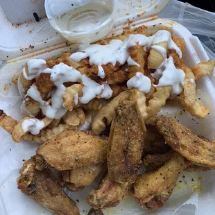 10 Piece Wings, lemon pepper and Cajun fries