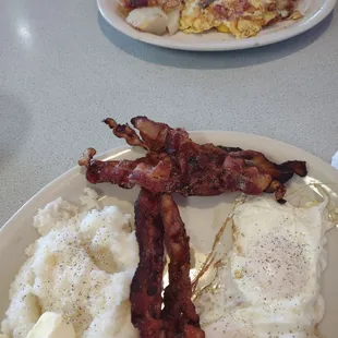Bacon and eggs breakfast and 3 meat omelette