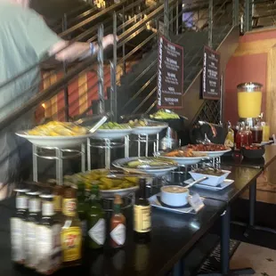 a man standing in front of a table full of food