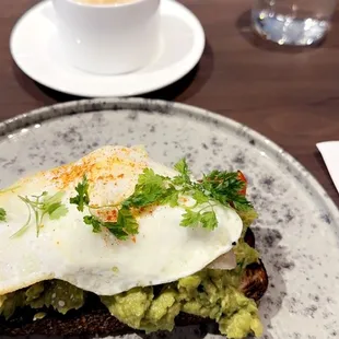 a plate of food and a cup of coffee