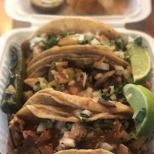 Shrimp tacos with grilled onions and mushrooms.  Super good!
