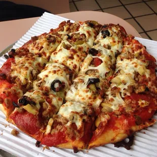 The Americana with hamburger and black olives added to the typical deluxe/supreme