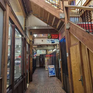 the inside of a store with a staircase leading to the second floor