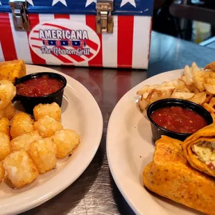 Breakfast burittos are available. Served with sides choice tater tots and waffle fries pictured. Let&apos;s go America!