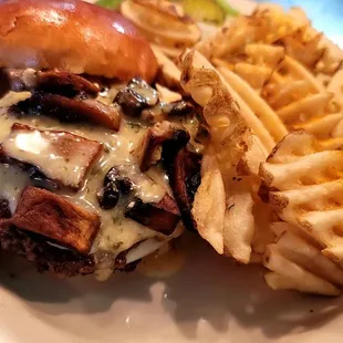 Garlic Parm Mushroom double Smashed burger served with waffle fries. Features vary week to week and when product is available.