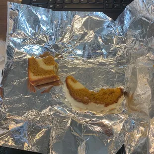 a grilled cheese sandwich on aluminum foil