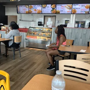 Inside with menu and cold case of salads and desserts