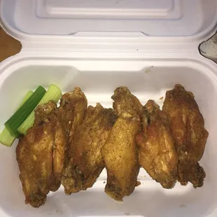 chicken wings in a styrofoam container