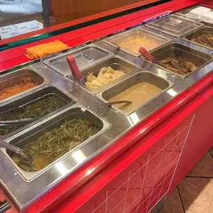 Soul Food Selection- sweet potatoes, greens, green beans, cabbage, turkey wings, chicken, ribs and pig feet