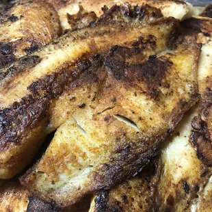 20-piece Grilled Tilapia, Cajun Style (on a bed of dirty rice!!!)
