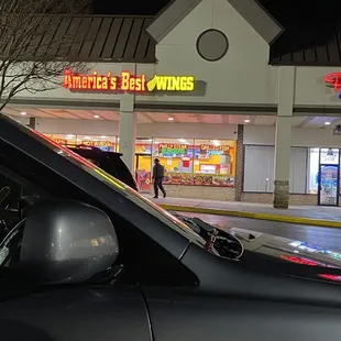 a car parked in front of a store