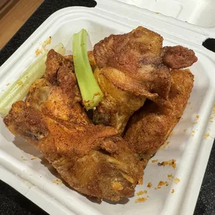 chicken wings in a styrofoam container