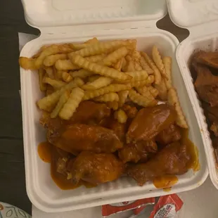 two takeout containers of food