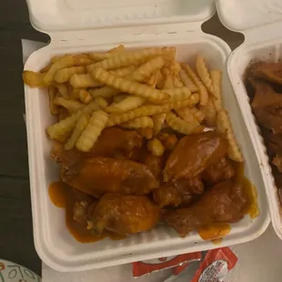 two takeout containers of food