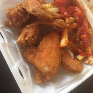 Four piece wings with a side of fries w/ ketchup , hot sauce , pepper and season salt