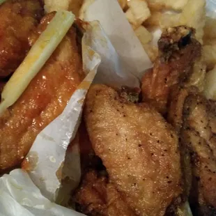 Thai Chili and Honey Garlic wings with french fries.