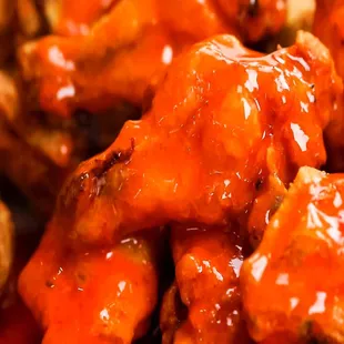 a closeup of a plate of wings