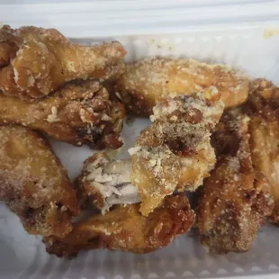 fried chicken wings in a styrofoam container