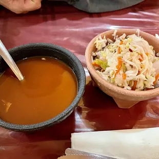 a bowl of soup and a bowl of coleslaw