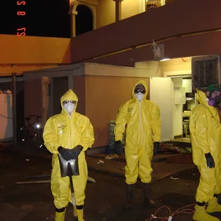 Technicians in their protective suits for sewage cleanup