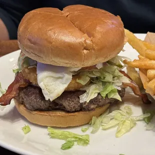a hamburger and fries on a plate