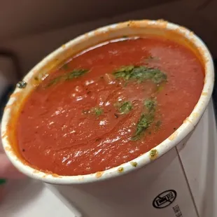 tomato soup in a paper cup