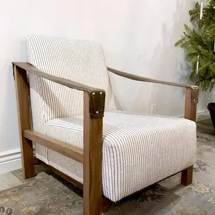 Anderson chair with stitches leather arms by Verellen