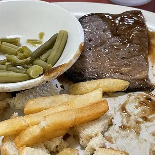 Roast beef dinner with added bread.