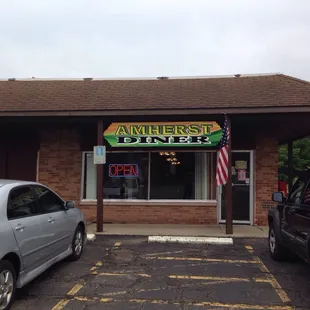 a car parked in front of the restaurant