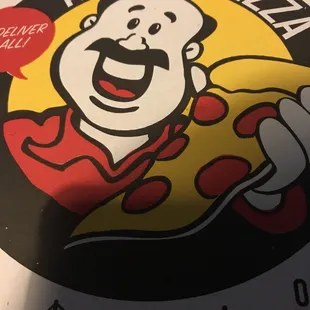 a smiling man holding a slice of pizza