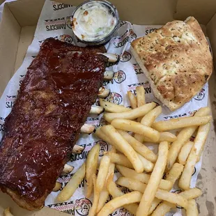 1/2 Slab Dinner $13 I believe...lots of those little clear cartilage / bone pieces.... not a pleasant mouth feel. Tender though