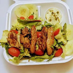 a meal in a styrofoam container