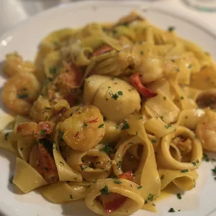 a plate of pasta and shrimp