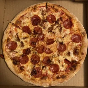 a pepperoni pizza in a box