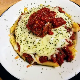 Baked Ziti penne smothered in our signature Amici marinara sauce topped with melted mozzarella cheese.